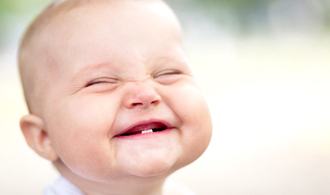 An infant smiling.