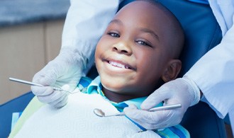 Little boy smiling after visiting Hillsboro emergency pediatric dentist  