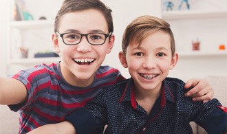 two young boys smiling  