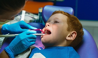 A child getting treatment for a dental emergency