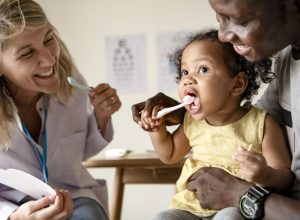 child and parent in dentist's office