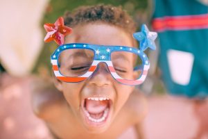 kid wearing patriotic glasses