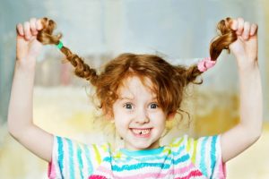 smiling child with a missing tooth