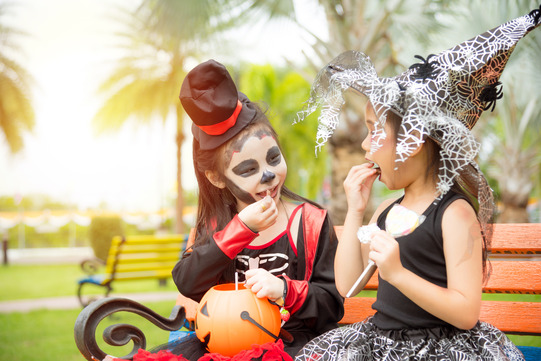 young children eating Halloween candy