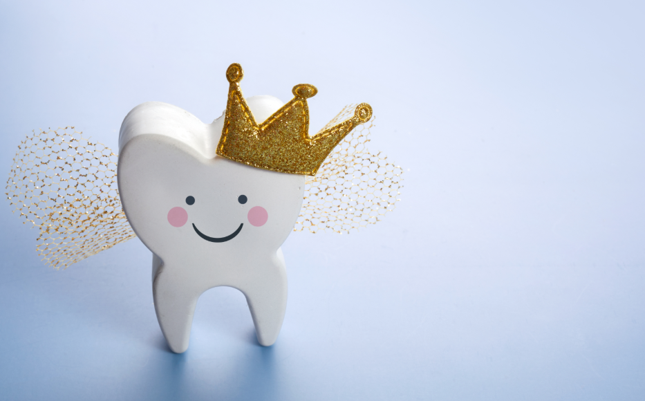 Tooth with a smiley face, crown, and fairy wings